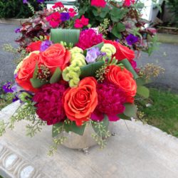 event flowers - silver urn with orange and pink